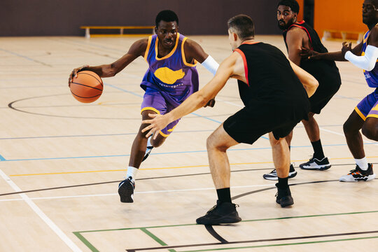 Power push: Athlete muscles through defense