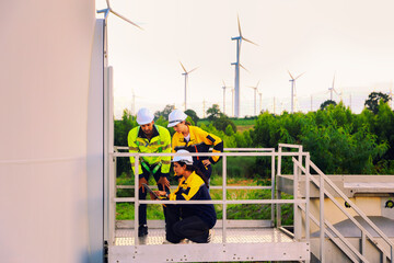 Team male technician explains the plan female engineer field work consultation in wind farm project...