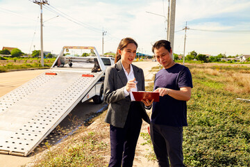 Female officer from car insurance company stands crosses her arms help take care damaged car and...