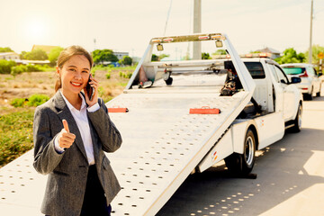 Happy asian businesswoman car broke down while traveling uses smartphone contact help emergency...