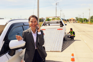 Smile relieve worries asian businesswoman car broke down while traveling uses smartphone contact...
