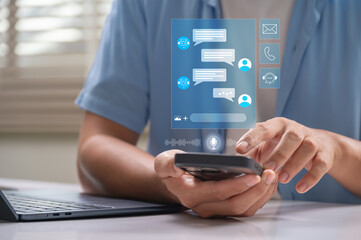 AI chatbot in customer service and support with automation. male user chatting on smartphone with...