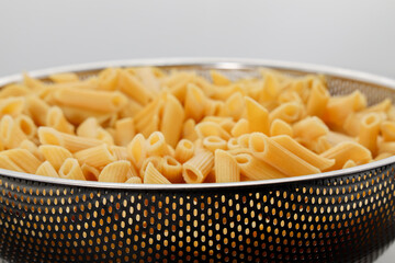 Pasta Penne bowl pre-cook white background