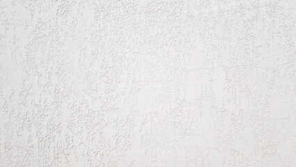 White textured plaster wall with decorative rough surface. Flat lay composition. background template with copy space. Mockup stage for displaying products, branding or advertising overlay