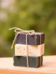 Stacked Handmade Soaps with Natural Twine Aromatic Skincare Gift Stack of three rustic bars for personal care and botanical beauty products on display