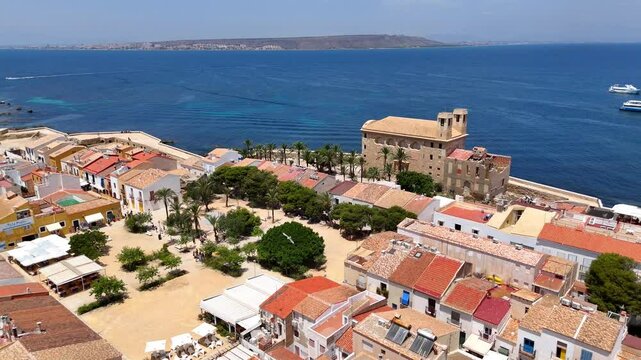 Aerial view of Tabarca Island with San Pedro y San Pablo church and buildings along a vast blue sea