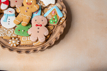 Gingerbread cookies with icing decoration. Christmas food. Gingerbread man baking. Top view table....