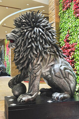 Lion sculpture stands majestically in Macau showcasing intricate design and cultural significance