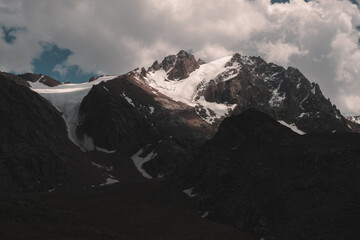 High mountains with rocks and glaciers in Kazakhstan are Tien Shan, Zailiysky Alatau in Almaty, the view opens from Talgar Pass