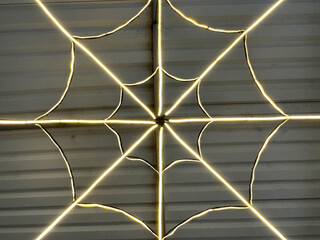 Close up of LED linear lights art arranged and positioned to form a geometric star shape pattern....