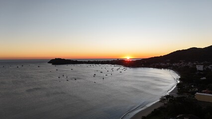 First light touches the ocean as the day begins — golden skies, calm seas, and nature in perfect...