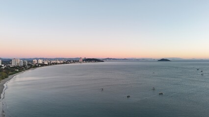 First light touches the ocean as the day begins — golden skies, calm seas, and nature in perfect...
