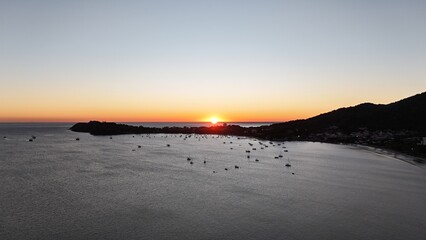 First light touches the ocean as the day begins — golden skies, calm seas, and nature in perfect...