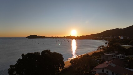 First light touches the ocean as the day begins — golden skies, calm seas, and nature in perfect...