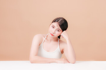 Portrait young asian woman sitting and thinking stressed about taking care of her health and skin...