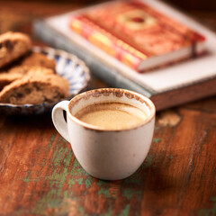 Cup of coffee and Cantuccini (Italian cookie) on dark wooden background. Copy space.