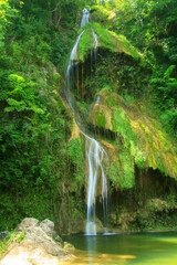 Pha Nam Yod Waterfall is 35 meters high and consists of three levels, shaped like umbrellas. It is...