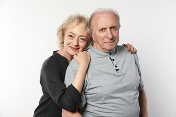Portrait of lovely senior couple on white background