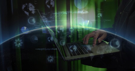 Typing mature Korean man holding laptop computer in high-tech environment, with green data overlays