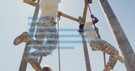 Climbing trainees in camouflage pants and boots ascending ropes on obstacle course, wooden beams