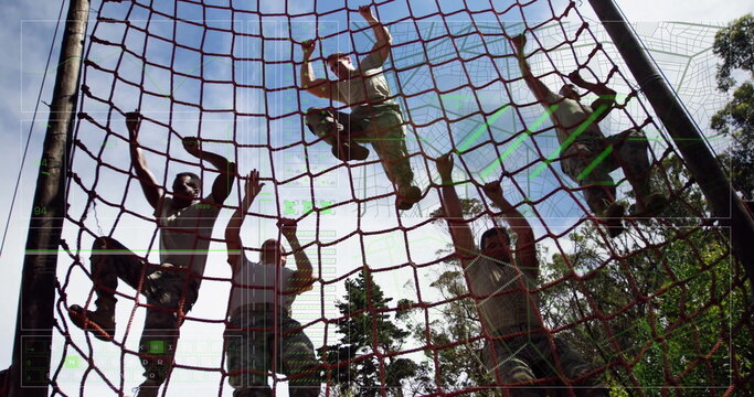 Climbing soldiers in camouflage pants pulling red rope cargo net at forest drill, showing teamwork - Powered by Adobe