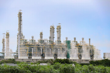 Oil refineries from the industrial zone Thailand surrounded by economic crops agriculture...