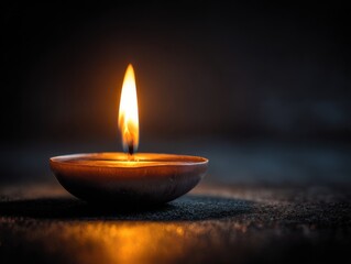 Celebrating diwali festival with traditional oil lamp india photography dark environment close-up light and culture