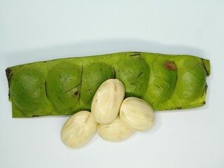 Fresh Green Parkia Speciosa or Bitter Bean with Pod and Seeds on White Background – Close-Up of...