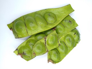 Fresh Green Parkia Speciosa or Bitter Bean with Pod and Seeds on White Background – Close-Up of...