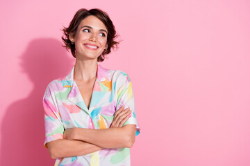 Portrait of nice young lady folded hands look empty space wear shirt isolated on pink color...