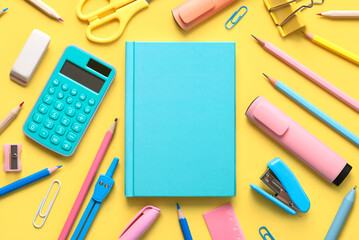 Top view of blue notepad and school supplies with space for text. Back to school concept