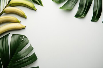 Photo of bananas on a white background with a banana leaf, top view, with copy space.