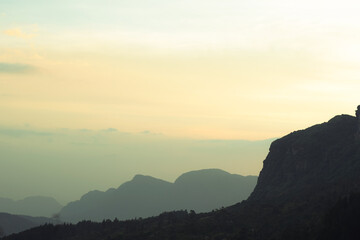 Beautiful sunset in the mountains floating clouds hill