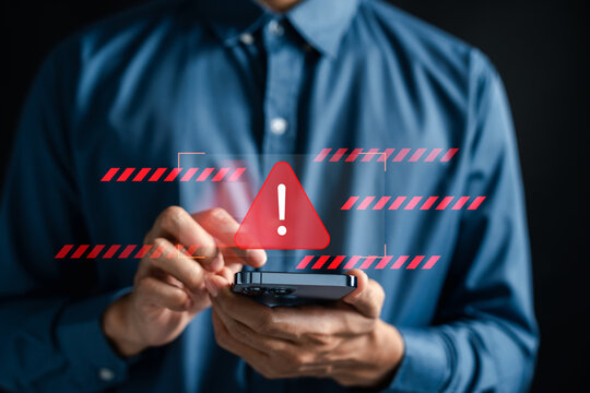 Cyber warning alert on smartphone screen symbolizing online crime threat and digital danger. Useful for cybersecurity, internet scam, phishing, and malware detection concept.