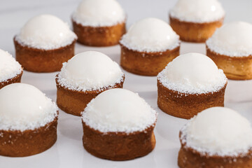 Tartlets with coconut cream and pineapple kulie. Coconut tartlets with gluten-free sponge cake,...