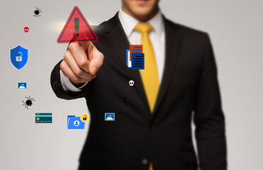 Businessman pressing warning alert icon, concept of warning message, digital security breach virtual digital interface screen