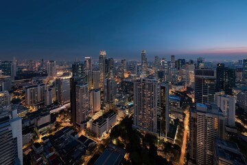 Fototapeta premium Stunning nighttime cityscape of skyscrapers illuminated in urban skyline