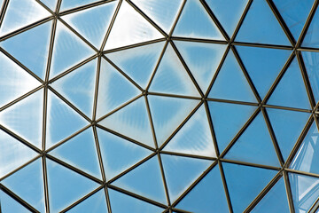 The blue glass roof with triangular patterns in modern building interiors