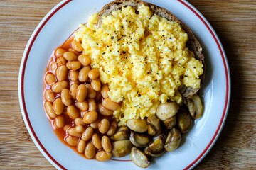 Scrambled Eggs Fried Mushrooms Baked Beans and Tomato Sauce