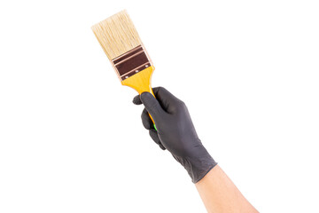 Hand in black glove holding paintbrush isolated on white