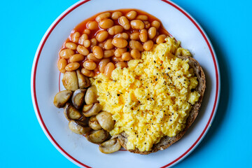 Scrambled Eggs Fried Mushrooms Baked Beans and Tomato Sauce