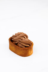 Dessert of dough, nut tartlets covered with a layer of caramel. Caramel tartlet, caramelized...