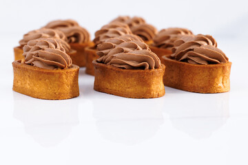 Caramel tartlet, caramelized peanuts, salted caramel, chocolate ganache. Tasty dessert. Dessert of...