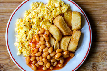 Scrambles Eggs With Baked Beans In Tomato Sauce And Thick Cut Fried Chips