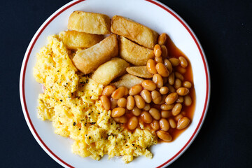 Scrambles Eggs With Baked Beans In Tomato Sauce And Thick Cut Fried Chips