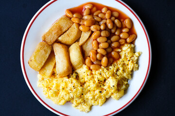 Scrambles Eggs With Baked Beans In Tomato Sauce And Thick Cut Fried Chips