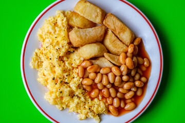 Scrambles Eggs With Baked Beans In Tomato Sauce And Thick Cut Fried Chips