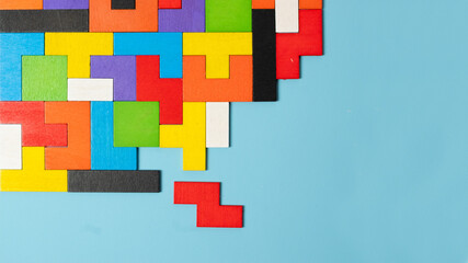 geometric shape block with colorful wood puzzle piece background. logical thinking, business logic, Conundrum, decision, solutions, rational, mission, success, goals and strategy concepts