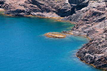 Crystal clear waters and rocky shore