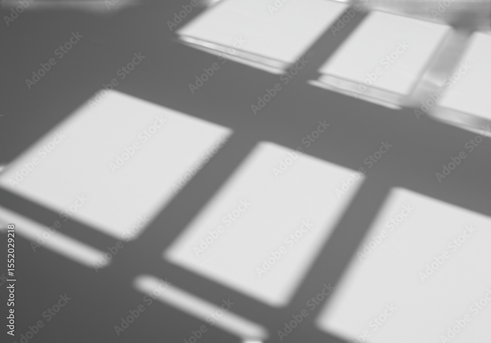 Poster soft, blurred shadows resembling window frames or abstract architectural shapes with clear contours,